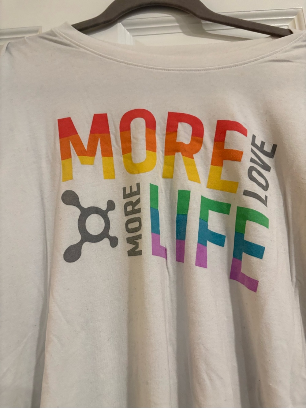 OrangeTheory Pride Graphic Tee - White with Rainbow Lettering